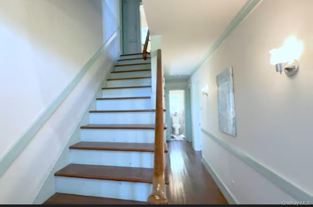 24 Hawkins Road Stony Brook, NY 11790 - Photo 7 of 45 a view of entryway and gallery with wooden floor