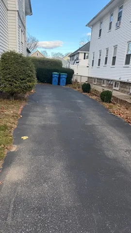 a view of house next to a road