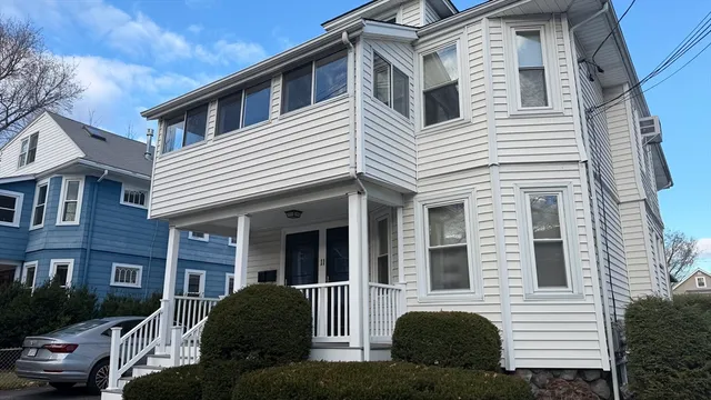 a view of a house with a yard and plants