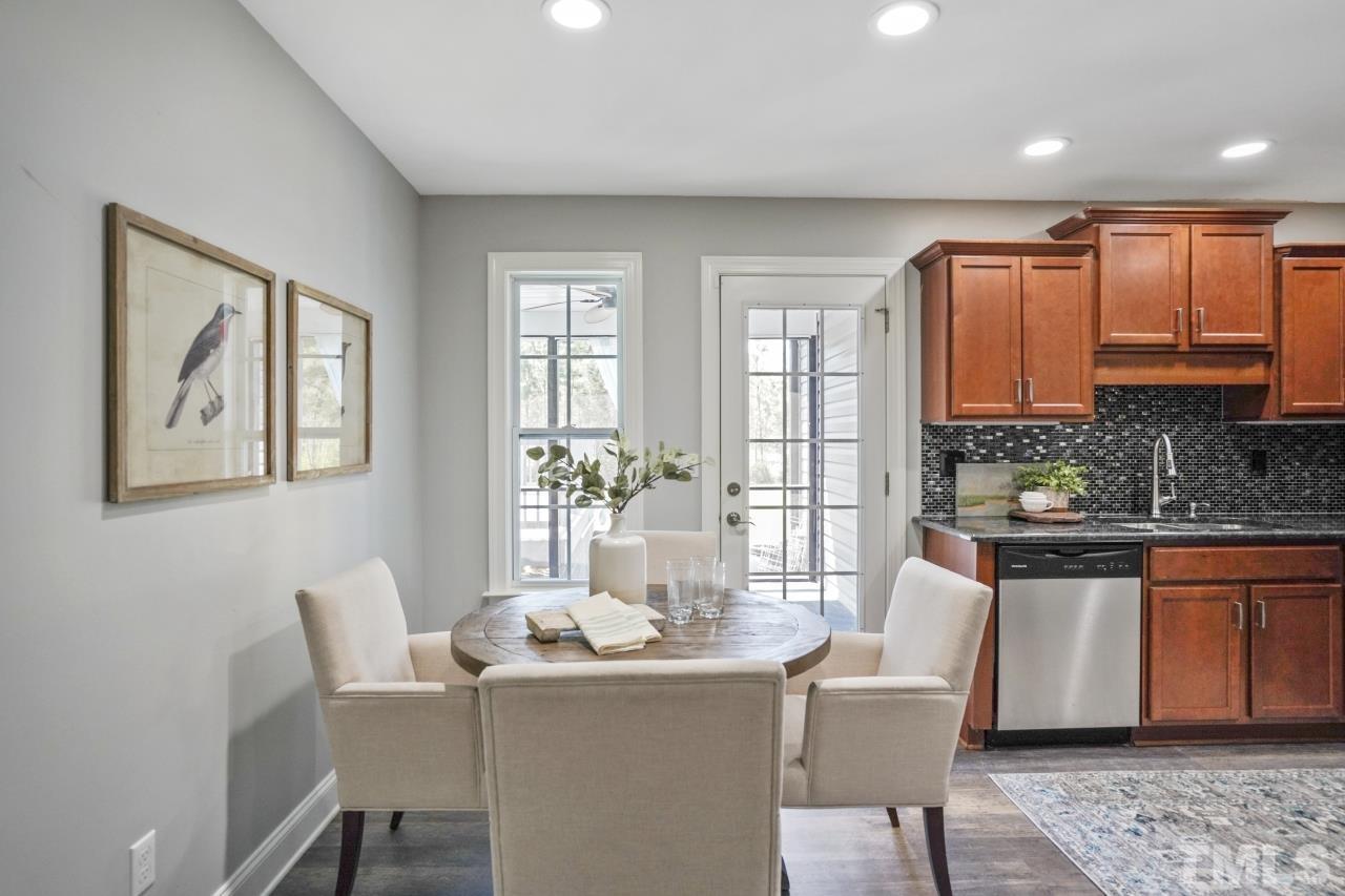 47 Hadleigh Way Fuquay-Varina, NC 27526 - Photo 13 of 37 a dining room with furniture a window and kitchen view