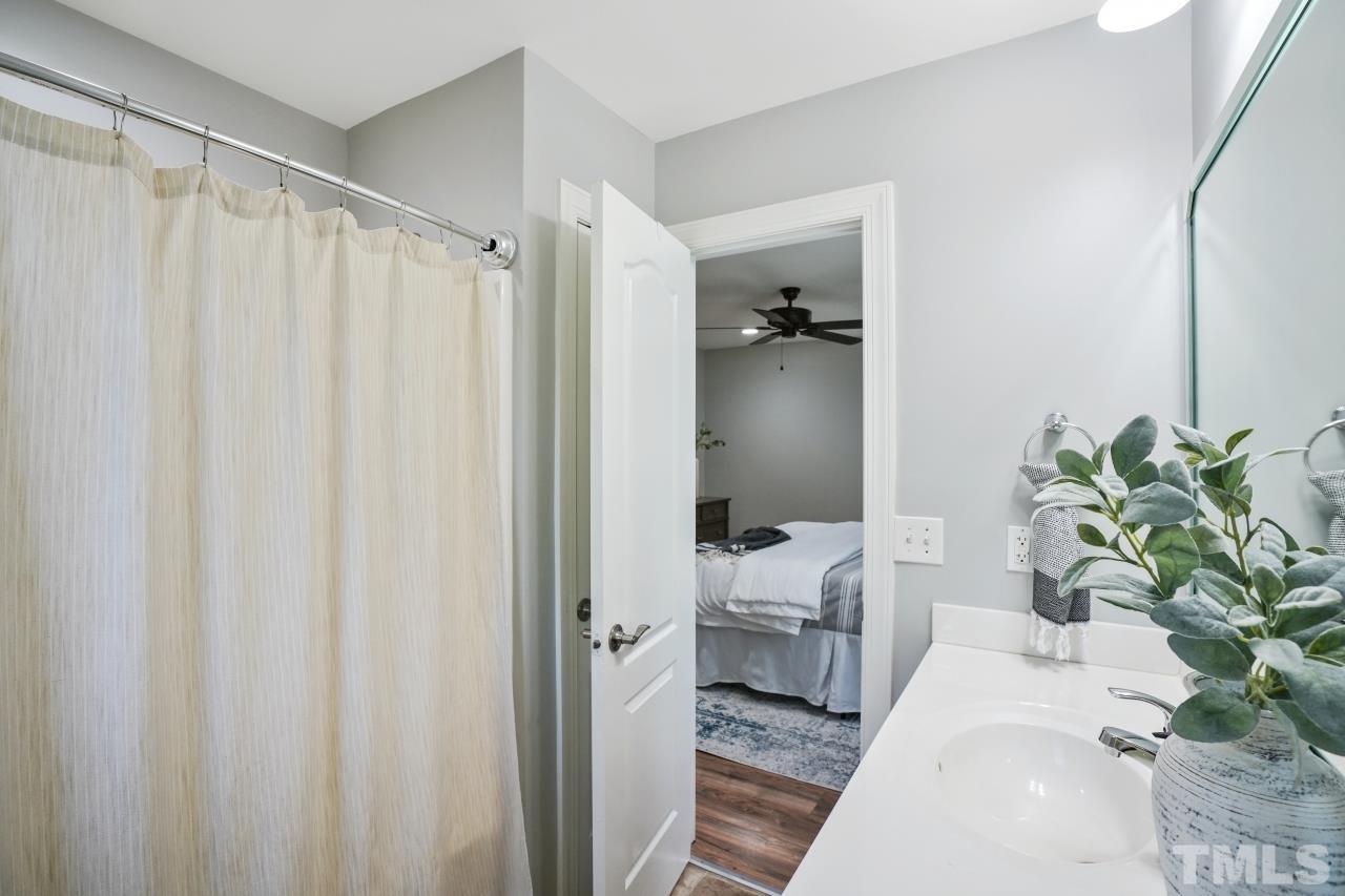 47 Hadleigh Way Fuquay-Varina, NC 27526 - Photo 19 of 37 a bed room with a bed and a plant