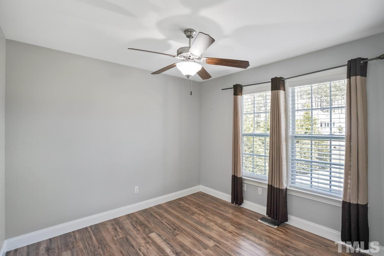 47 Hadleigh Way Fuquay-Varina, NC 27526 - Photo 20 of 37 wooden floor in an empty room with a window
