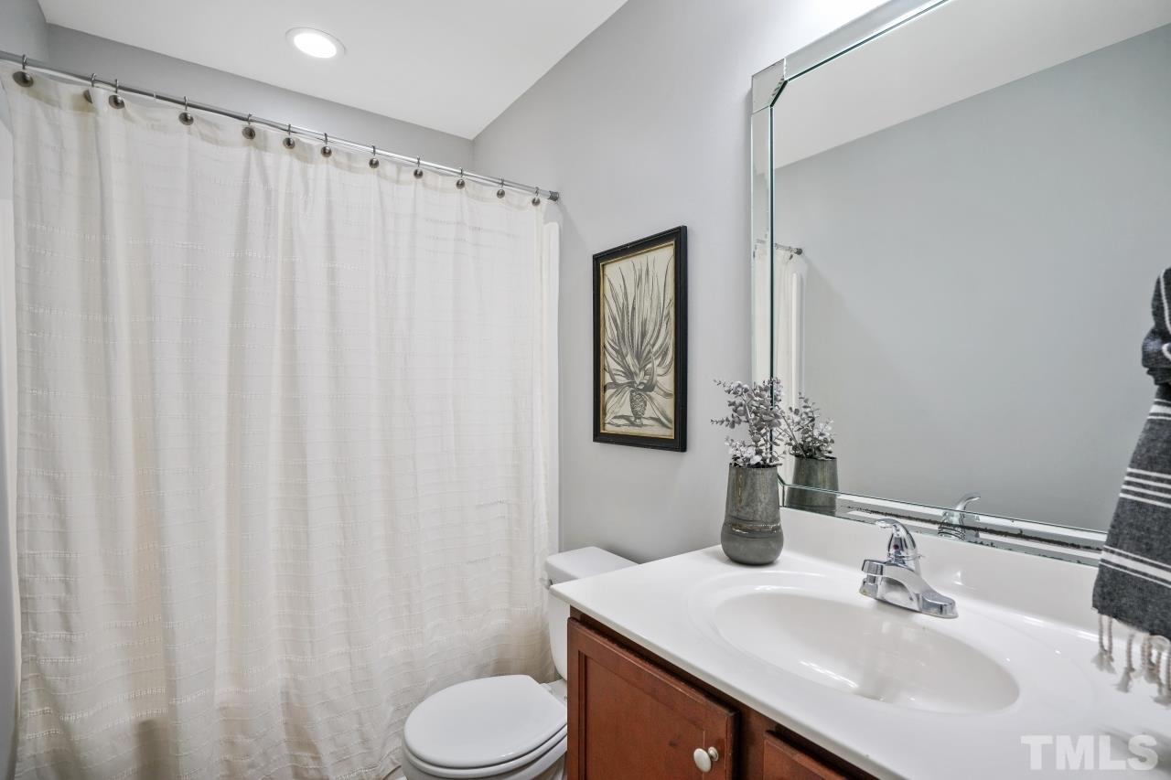 47 Hadleigh Way Fuquay-Varina, NC 27526 - Photo 21 of 37 a bathroom with a sink and a mirror