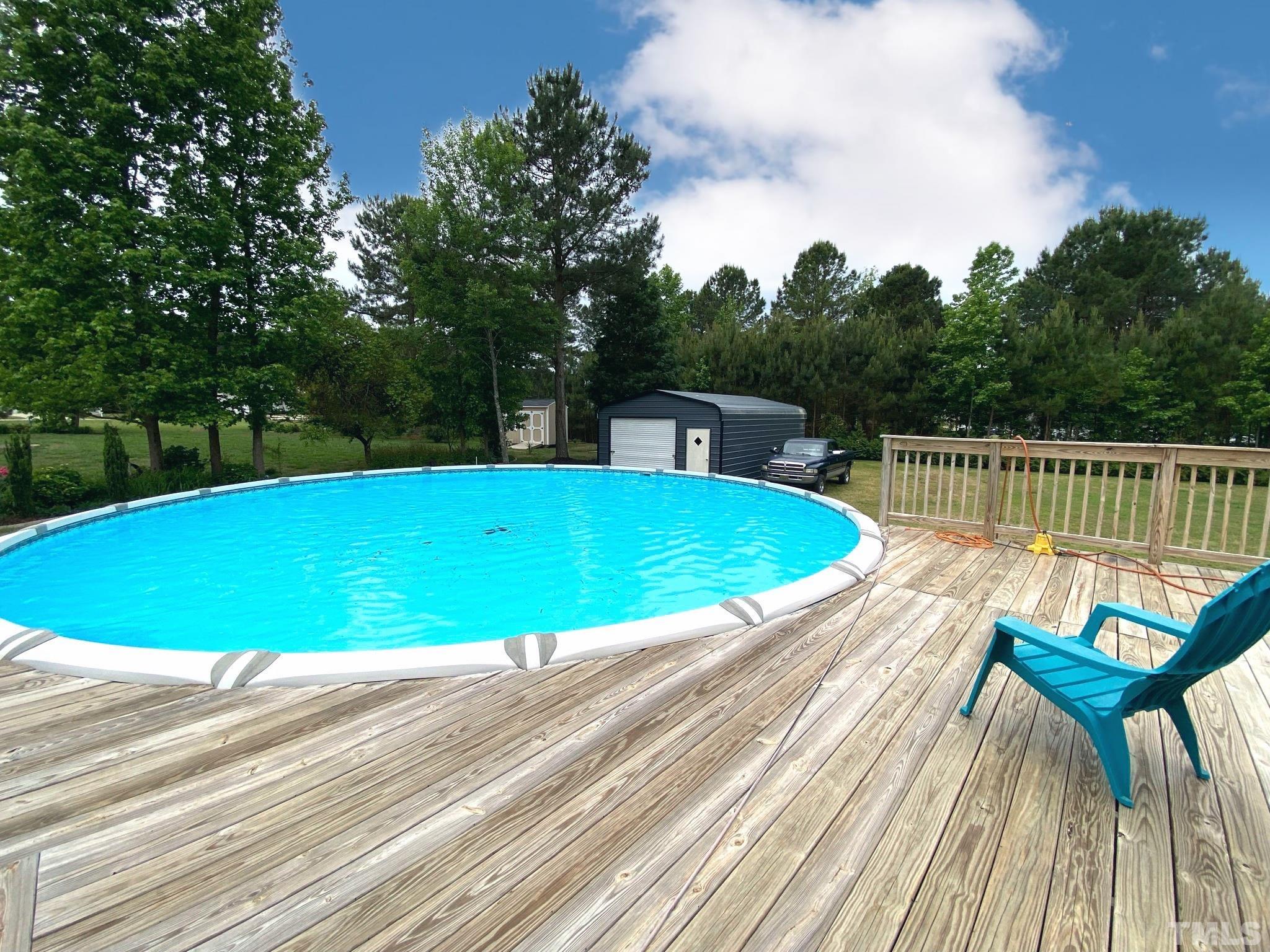 47 Hadleigh Way Fuquay-Varina, NC 27526 - Photo 25 of 37 a view of a swimming pool with a patio