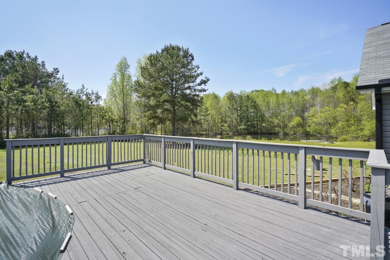 47 Hadleigh Way Fuquay-Varina, NC 27526 - Photo 29 of 37 a balcony with wooden floor and fence