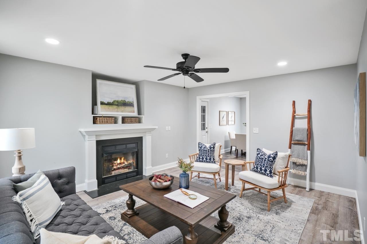 47 Hadleigh Way Fuquay-Varina, NC 27526 - Photo 3 of 37 a living room with furniture and a fireplace