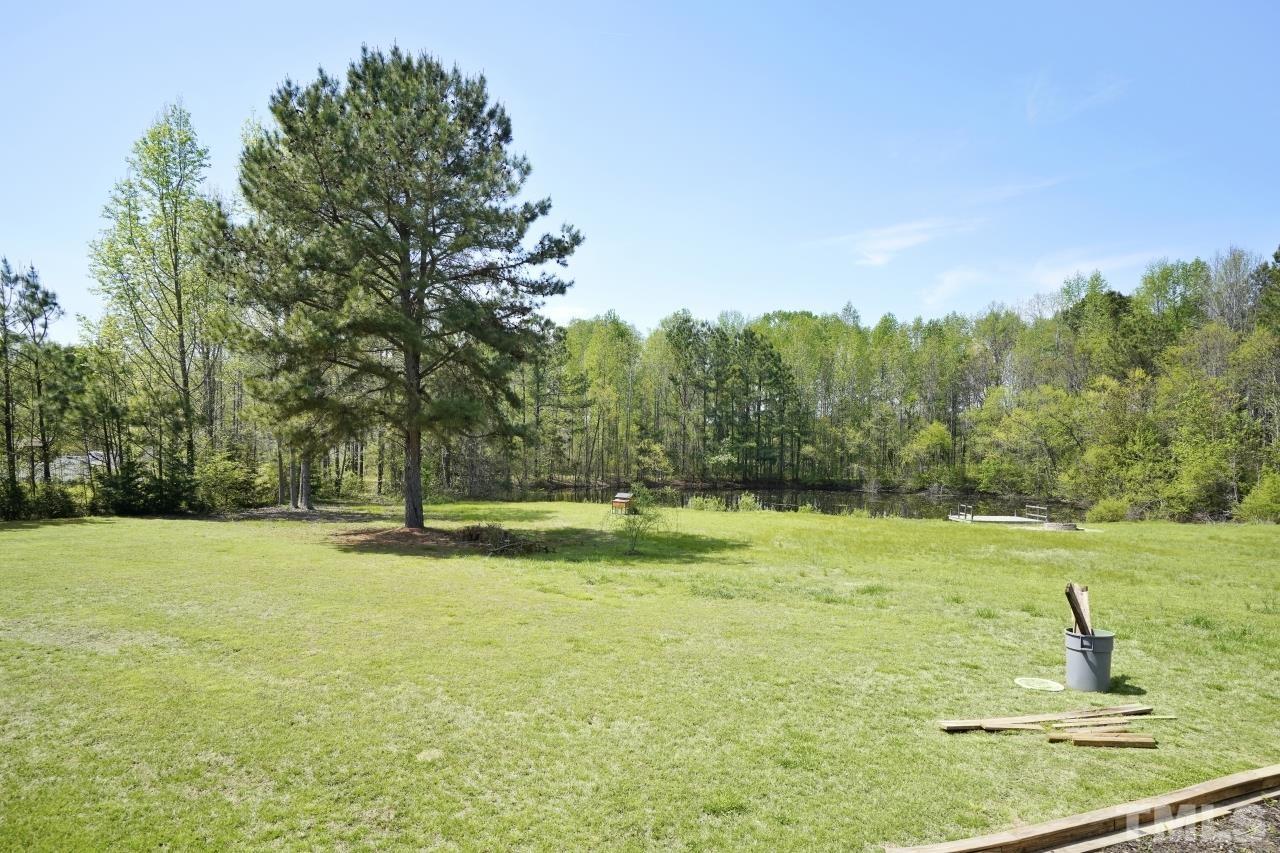47 Hadleigh Way Fuquay-Varina, NC 27526 - Photo 33 of 37 a view of a field with trees in the background