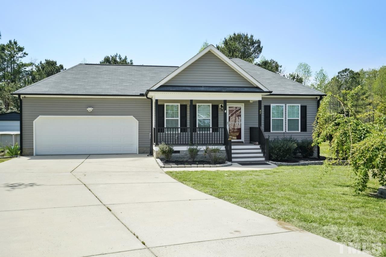 47 Hadleigh Way Fuquay-Varina, NC 27526 - Photo 35 of 37 a front view of a house with yard