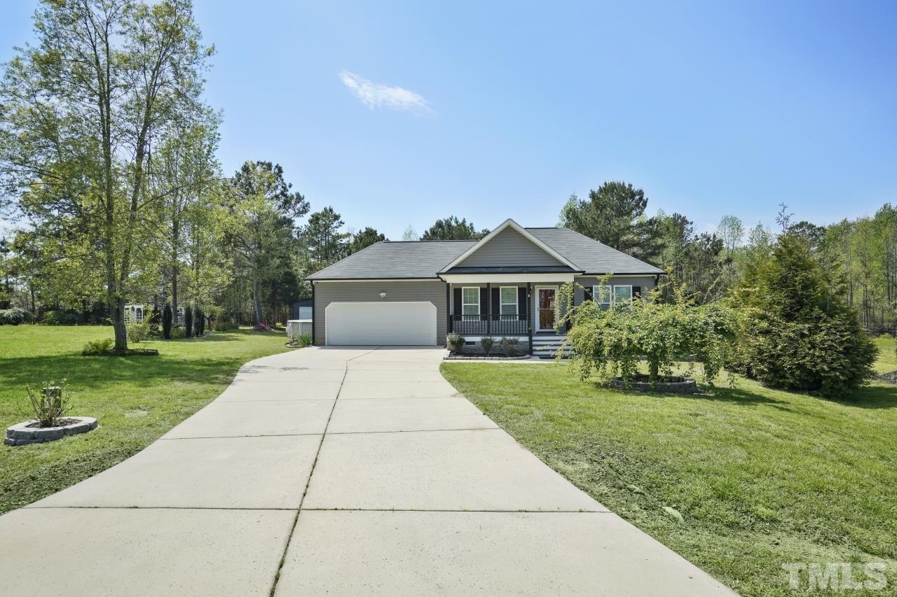 47 Hadleigh Way Fuquay-Varina, NC 27526 - Photo 36 of 37 a front view of house with yard and trees