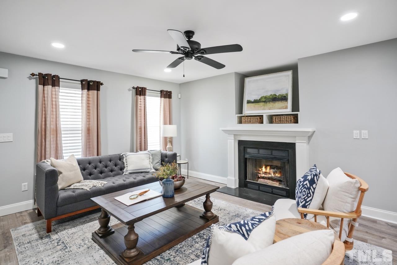 47 Hadleigh Way Fuquay-Varina, NC 27526 - Photo 4 of 37 a living room with furniture and a fireplace