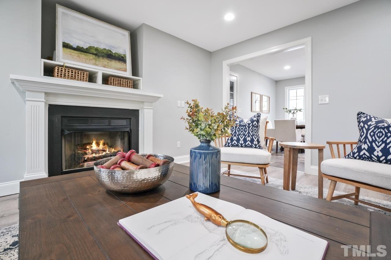 47 Hadleigh Way Fuquay-Varina, NC 27526 - Photo 6 of 37 a living room with furniture and a fireplace