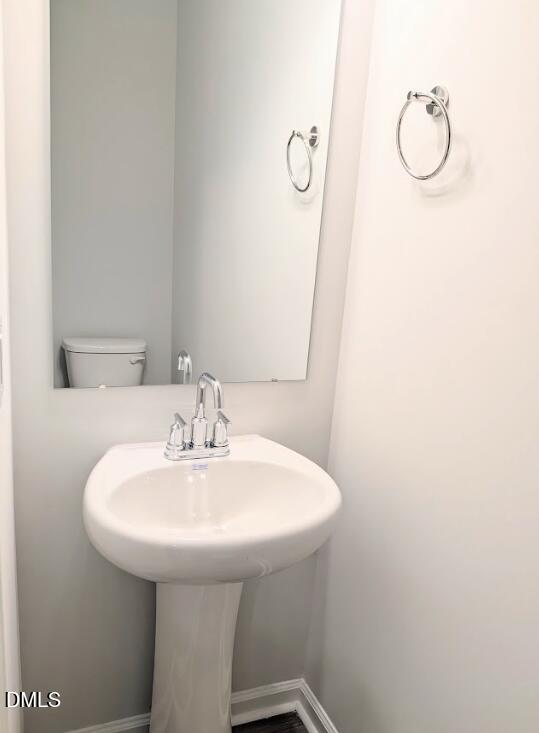 4029 Kidd Place Durham, NC 27703 - Photo 15 of 28 a bathroom with a sink and mirror