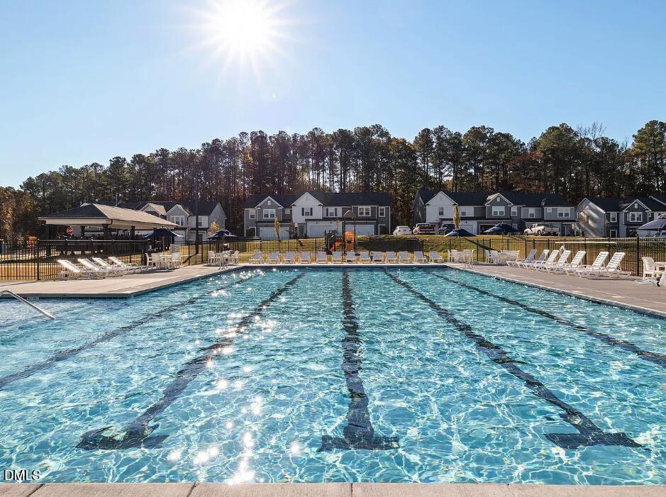 4029 Kidd Place Durham, NC 27703 - Photo 4 of 28 a view of a swimming pool with a yard and sitting area