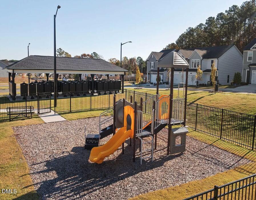 4029 Kidd Place Durham, NC 27703 - Photo 7 of 28 a view of a swimming pool with a lounge chairs