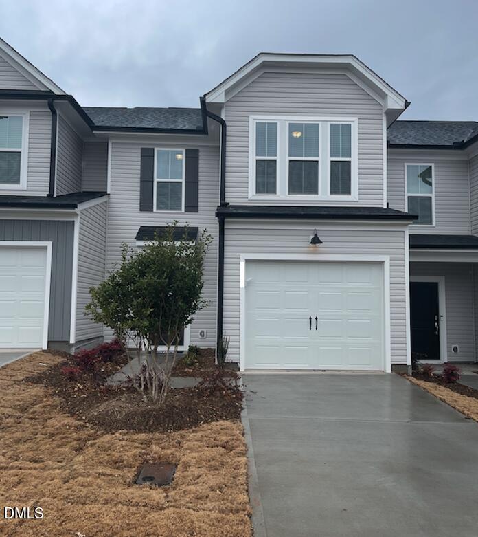 4029 Kidd Place Durham, NC 27703 - Photo 8 of 28 a front view of a house with garden