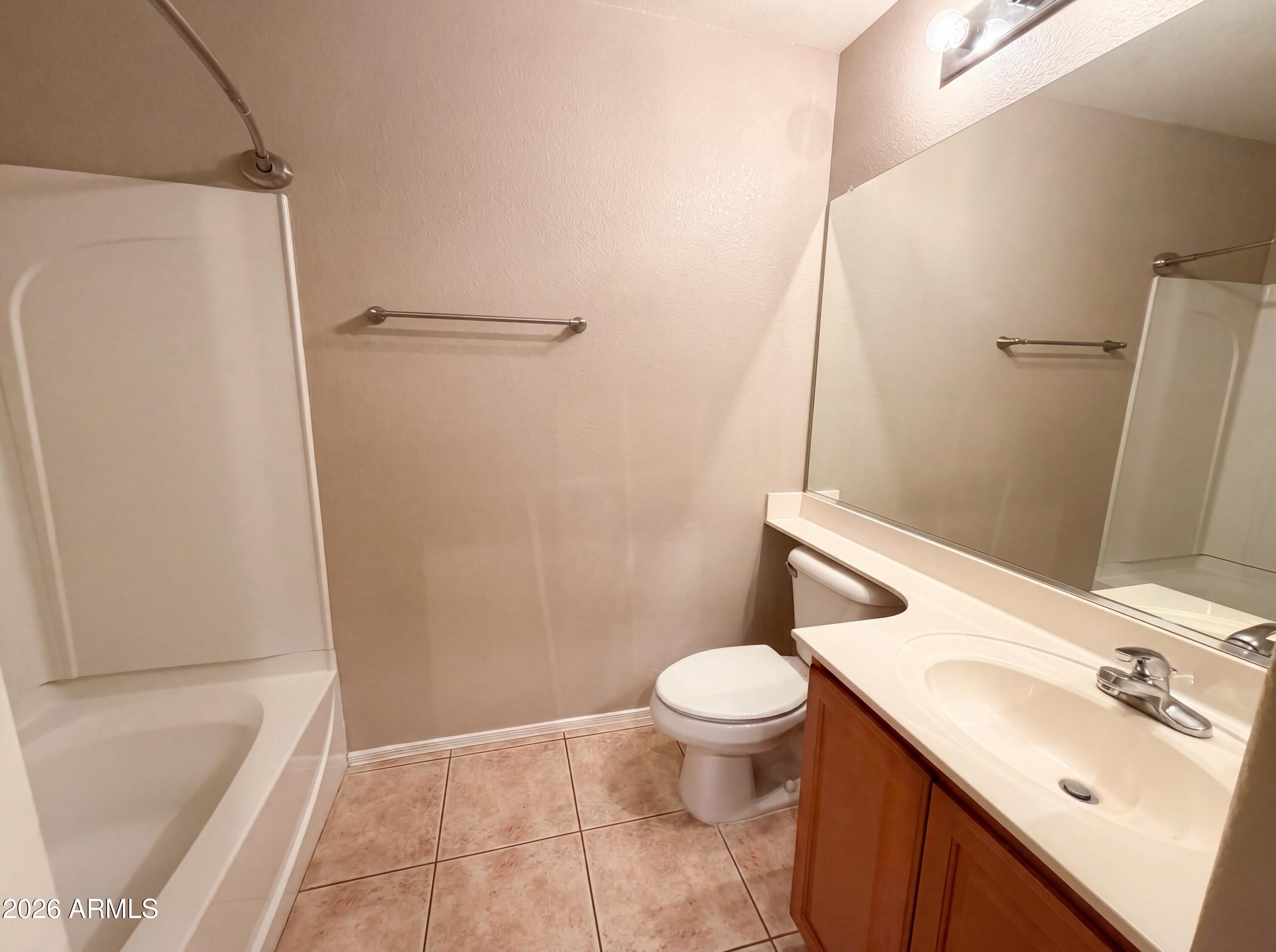 1565 East Hopkins Road Gilbert, AZ 85295 - Photo 10 of 29 a bathroom with a sink a toilet and shower