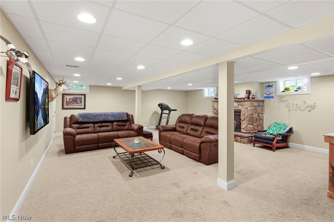 1720 Steiner Road Creston, OH 44217 - Photo 20 of 29 Lower level family room with a propane insert/fireplace