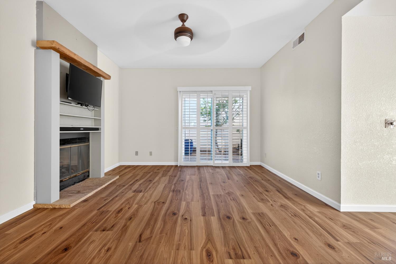 2757 Lakeview Drive Santa Rosa, CA 95405 - Photo 3 of 54 a view of empty room with wooden floor and electronic appliances
