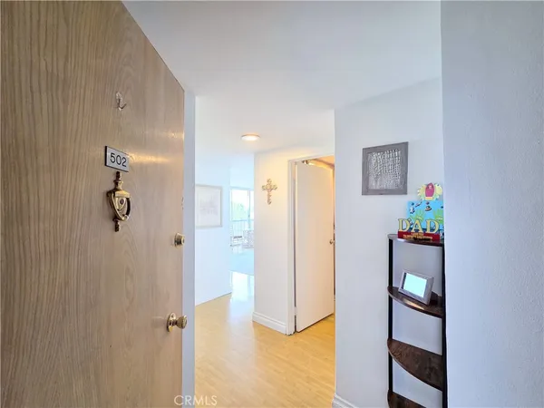 a view of a hallway with bathroom