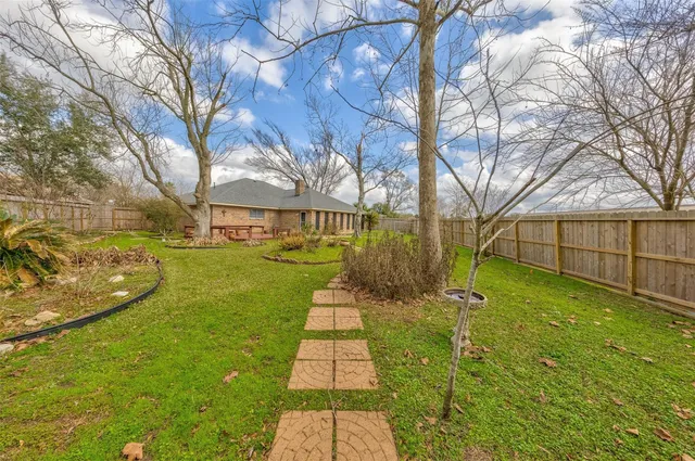 a view of yard with swimming pool