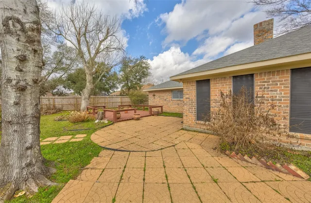 a view of a backyard of the house