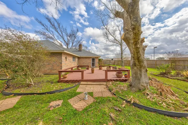 a view of yard with swimming pool