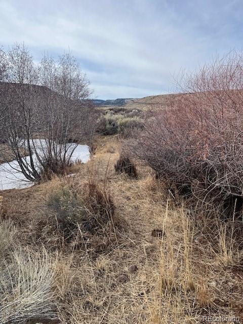Lot 23 Canyon Road Antonito, CO 81120 - Photo 18 of 29 a view of a dry yard with wooden fence