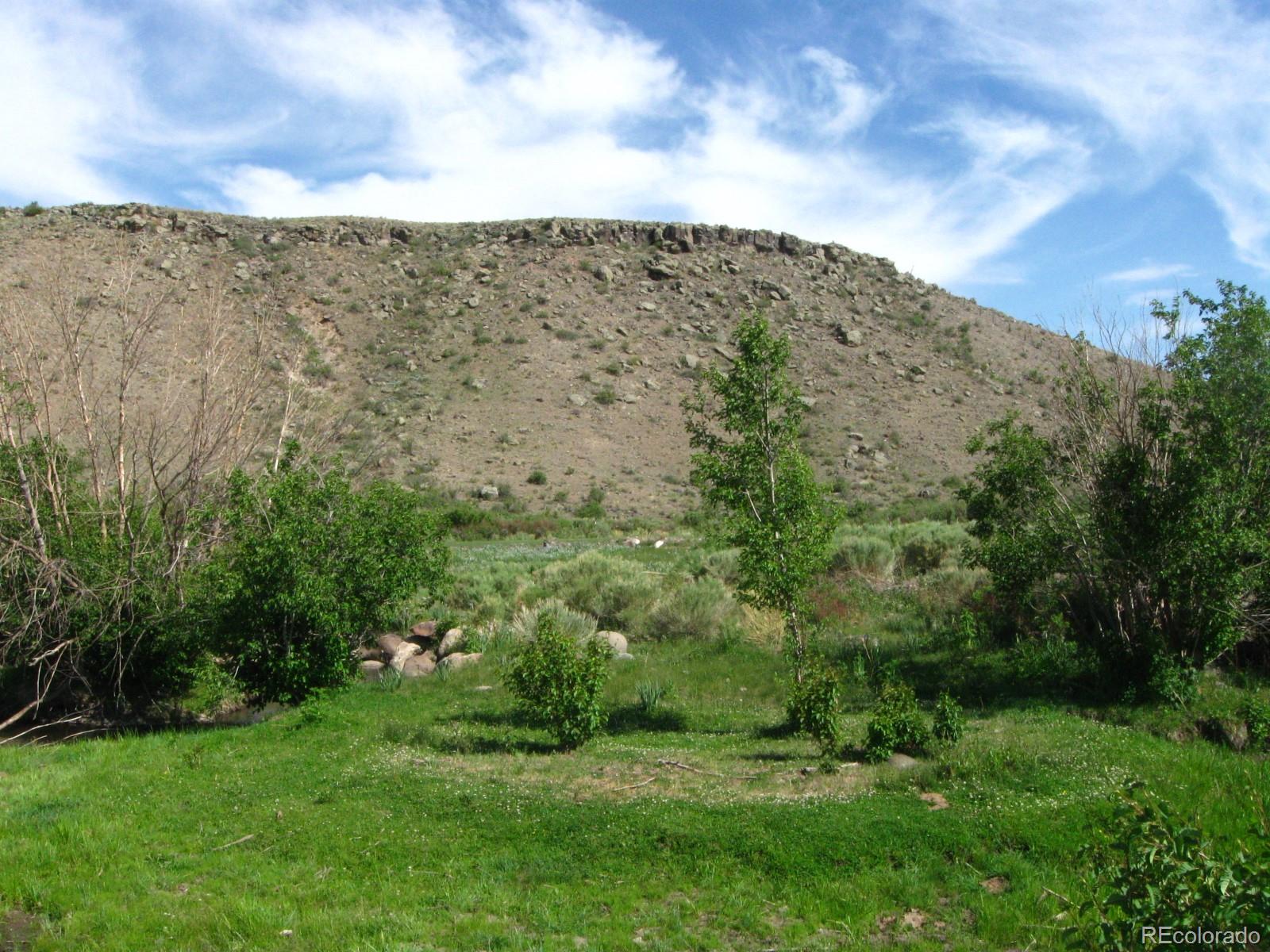 Lot 23 Canyon Road Antonito, CO 81120 - Photo 4 of 29 a view of a large building with a yard