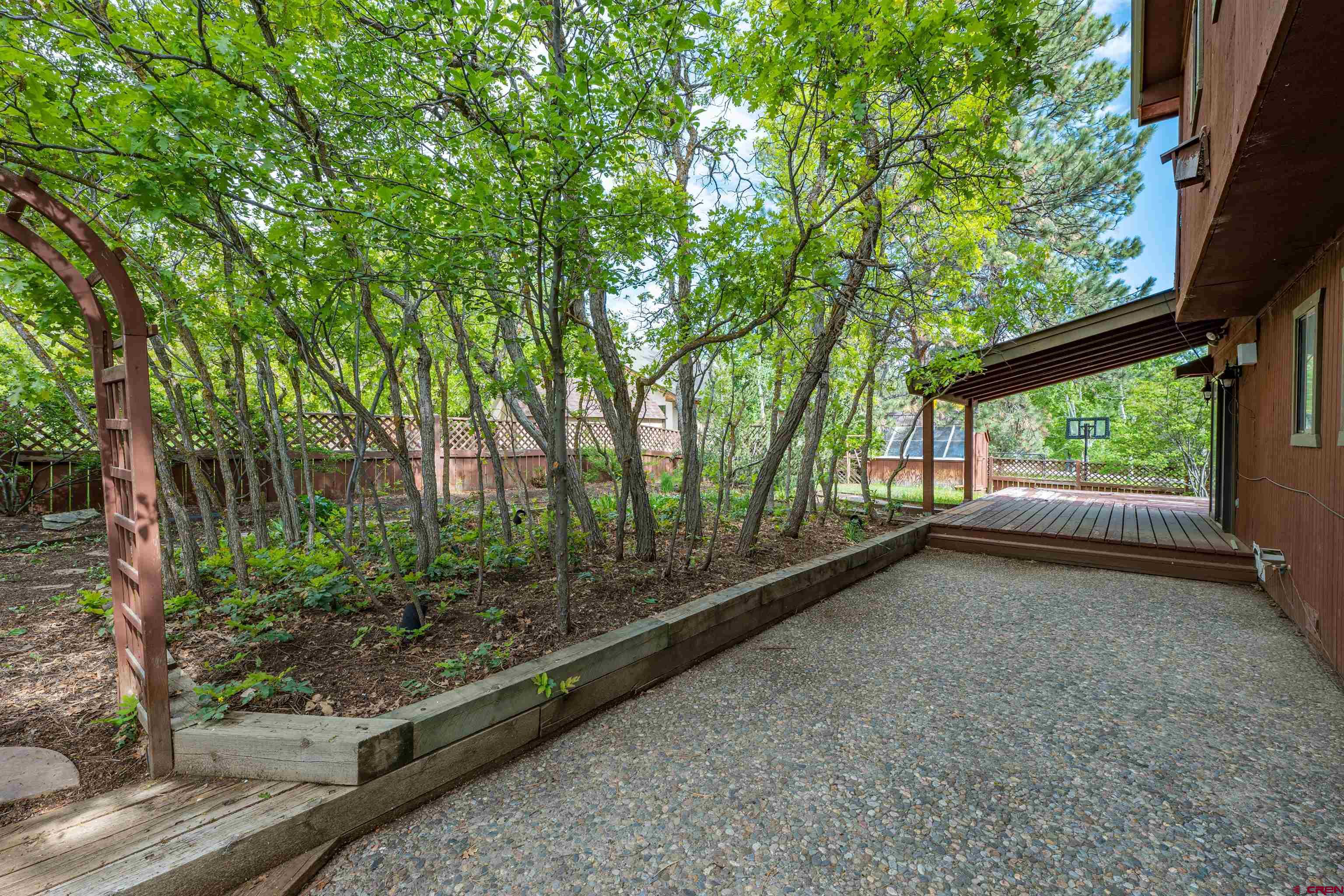 284 Willow Drive Durango, CO 81301 - Photo 14 of 35 a view of a garden with plants and large trees