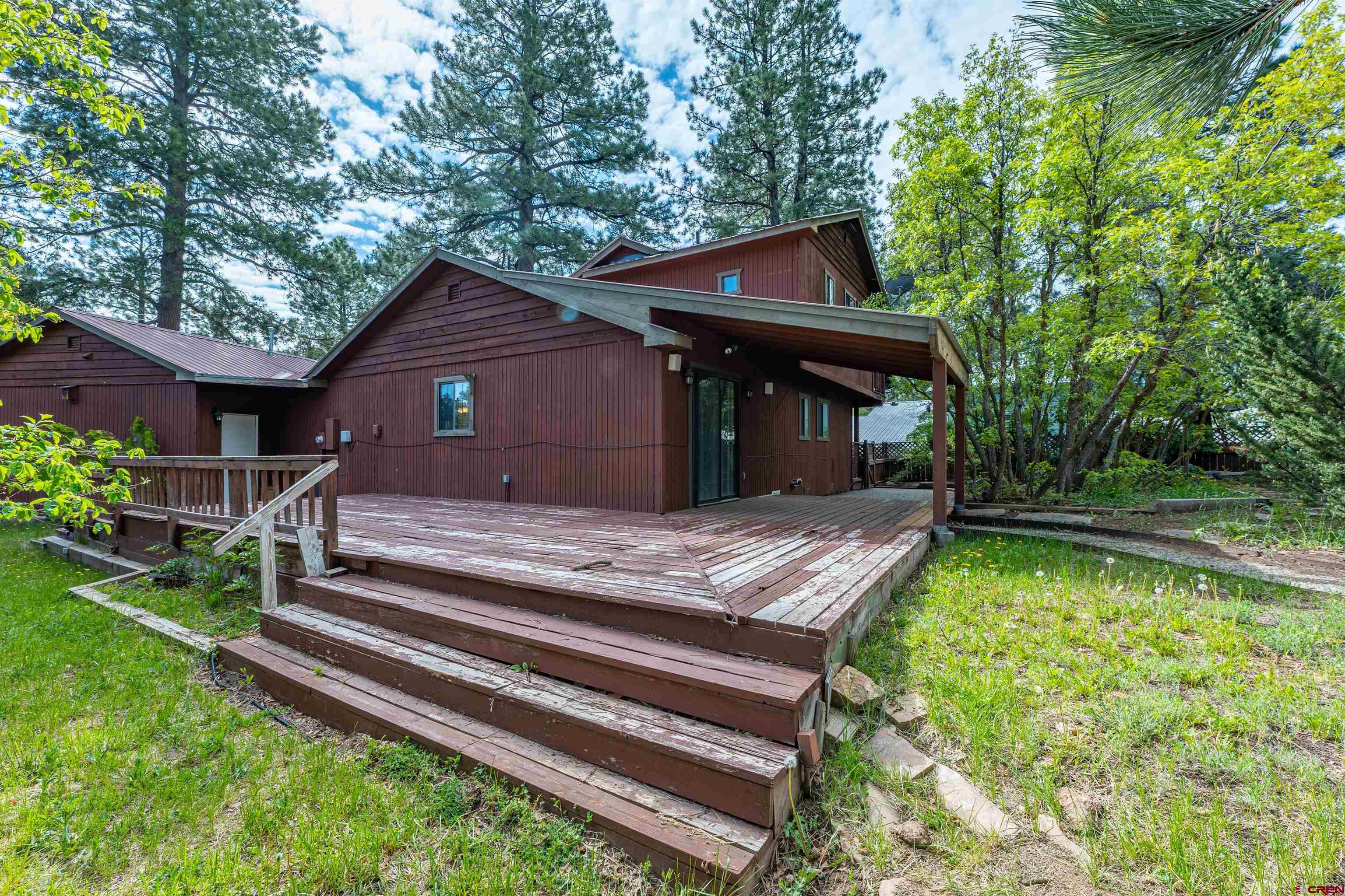 284 Willow Drive Durango, CO 81301 - Photo 15 of 35 a front view of a house with a yard table and chairs
