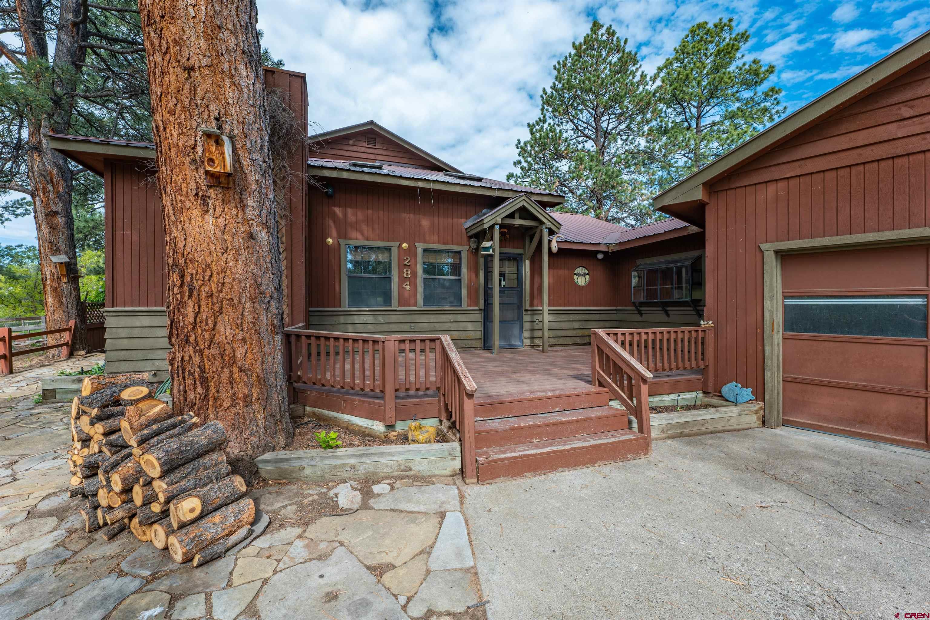284 Willow Drive Durango, CO 81301 - Photo 2 of 35 a front view of a house with a yard