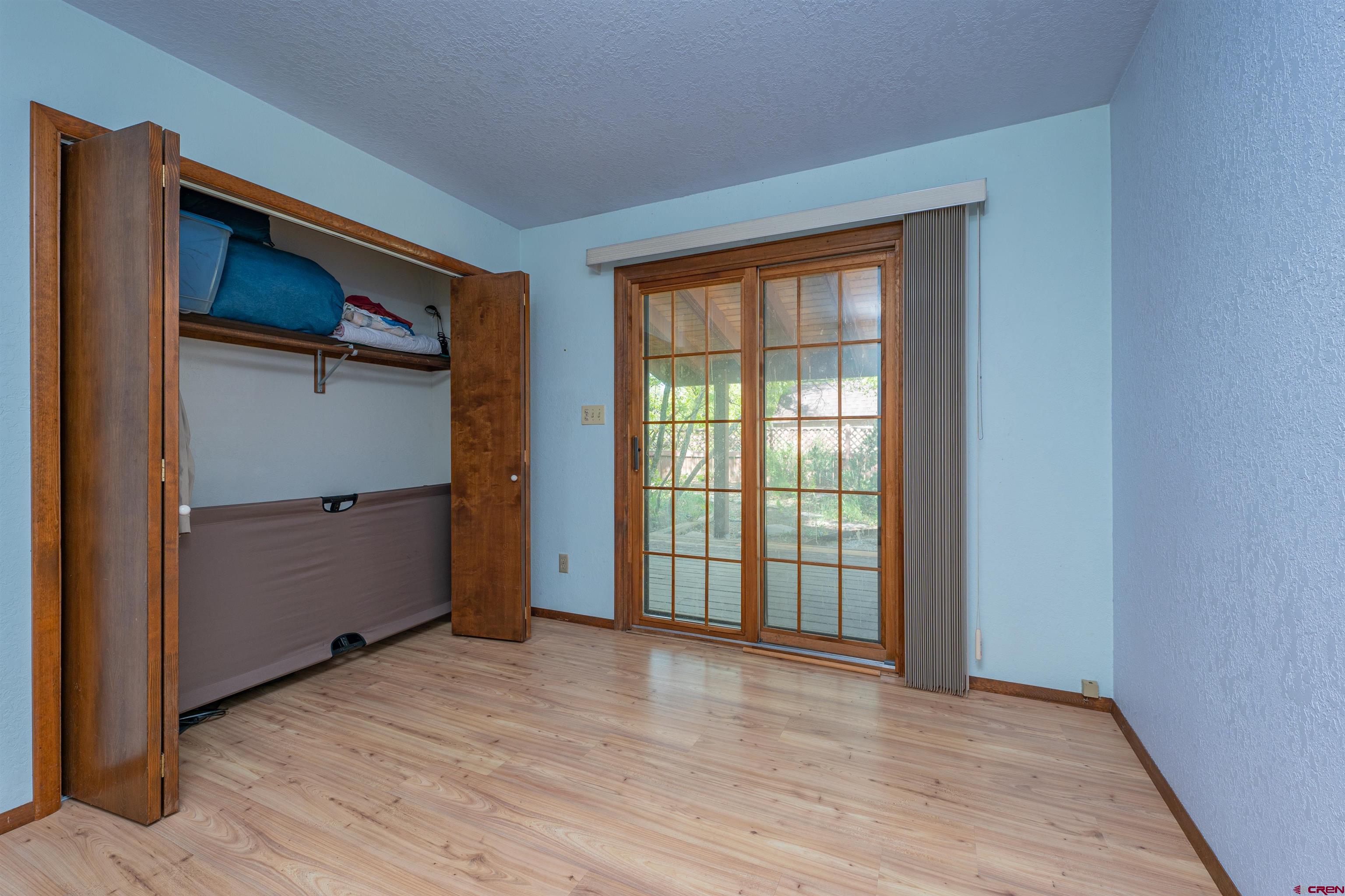 284 Willow Drive Durango, CO 81301 - Photo 24 of 35 an empty room with wooden floor and a window