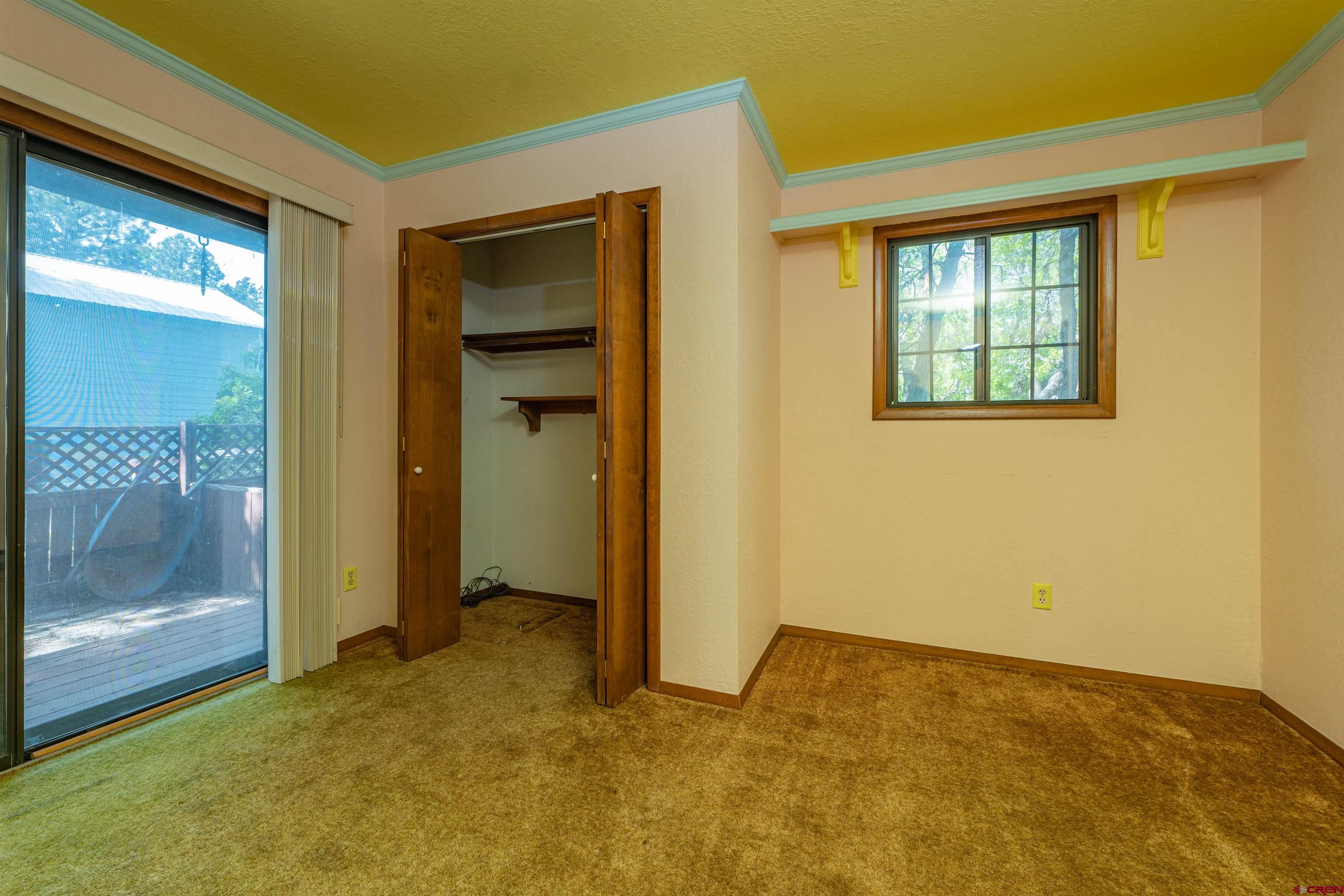 284 Willow Drive Durango, CO 81301 - Photo 26 of 35 a view of an empty room with closet and a window