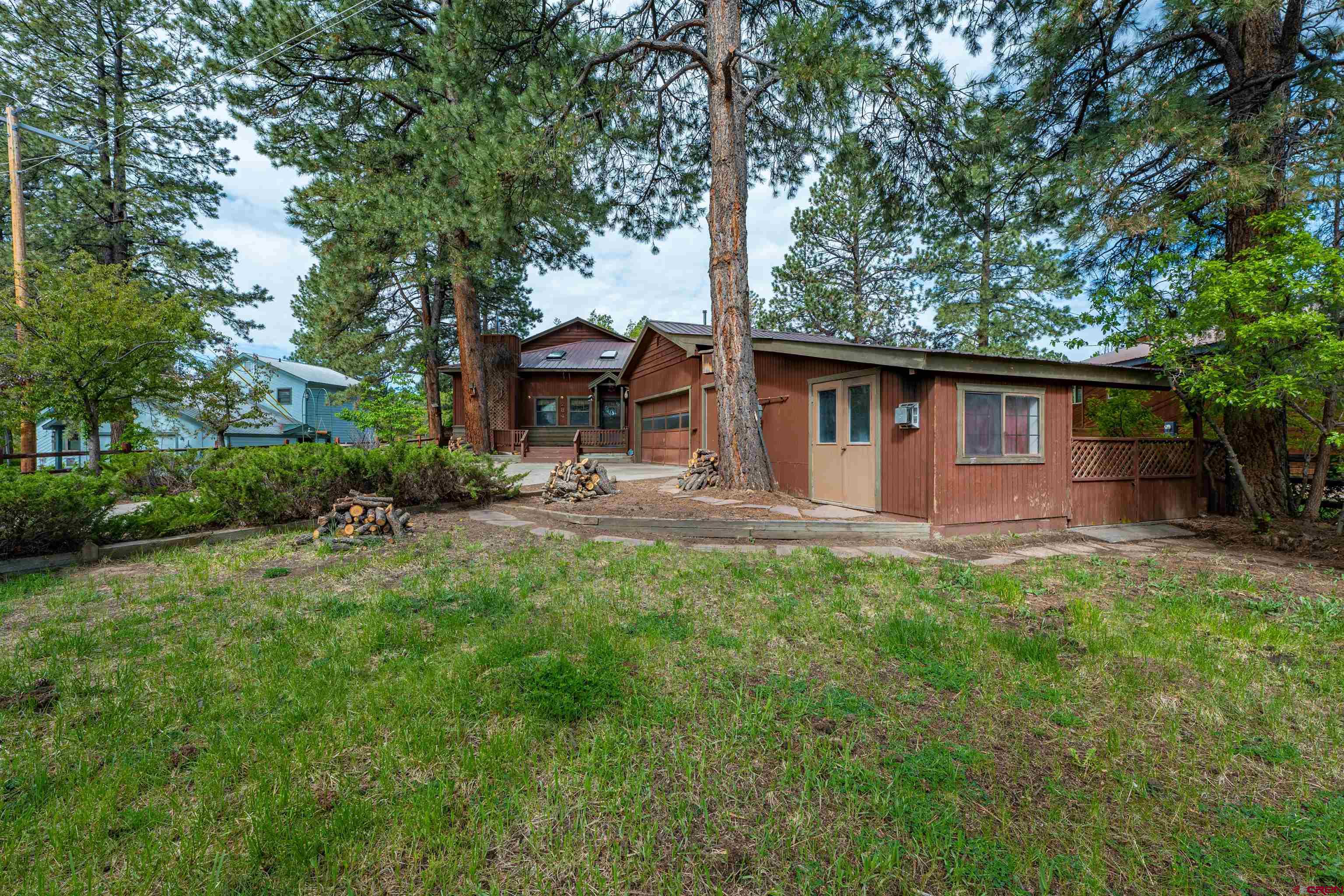 284 Willow Drive Durango, CO 81301 - Photo 3 of 35 a backyard of a house with table and chairs