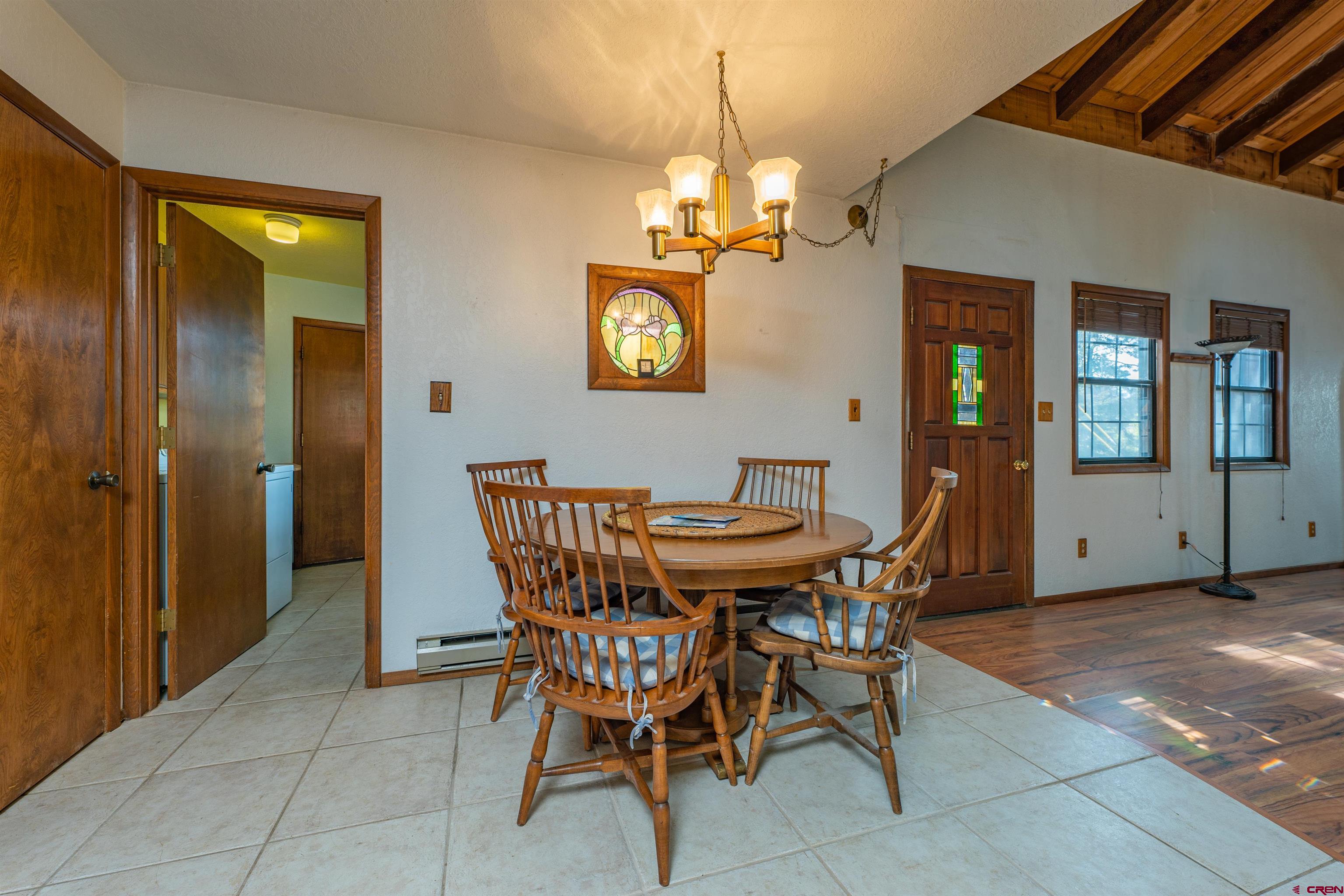 284 Willow Drive Durango, CO 81301 - Photo 6 of 35 a view of a dining room with furniture and a chandelier