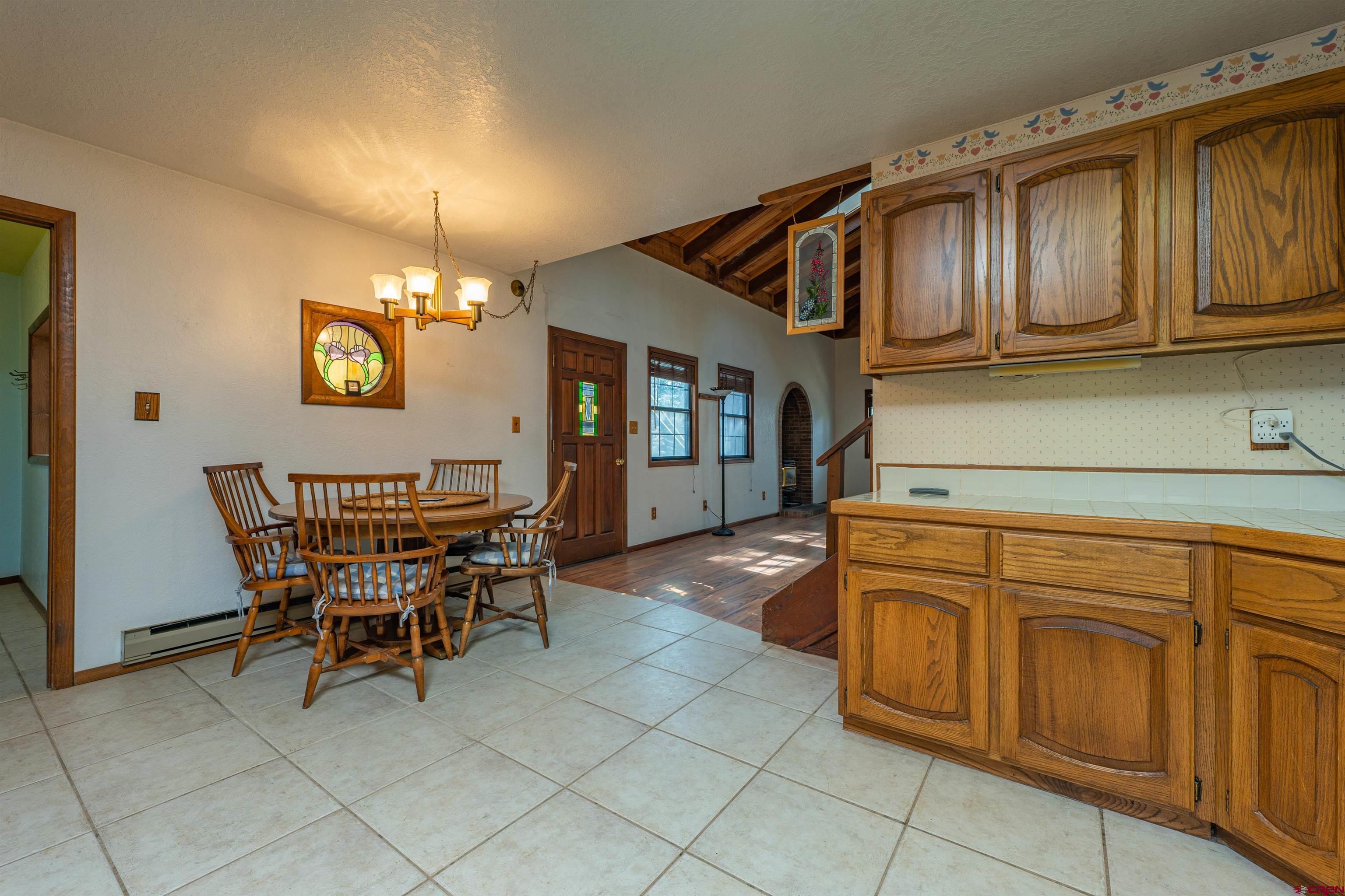 284 Willow Drive Durango, CO 81301 - Photo 8 of 35 a view of a kitchen area with furniture and chandelier
