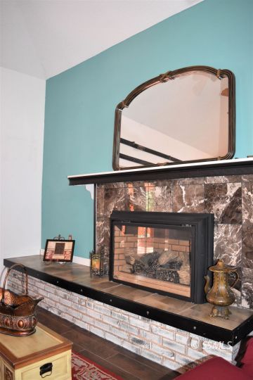 417 Montefino Drive Ridgecrest, CA 93555 - Photo 7 of 25 a view of fireplace with wooden floor