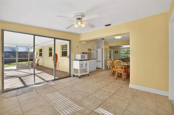 a view of a livingroom with furniture and a ceiling fan