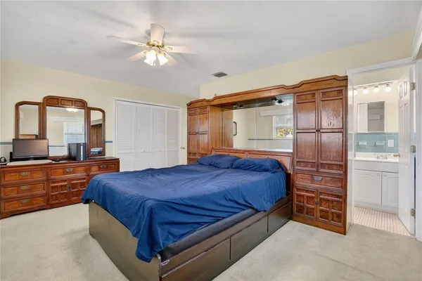 a bedroom with a bed and a dresser