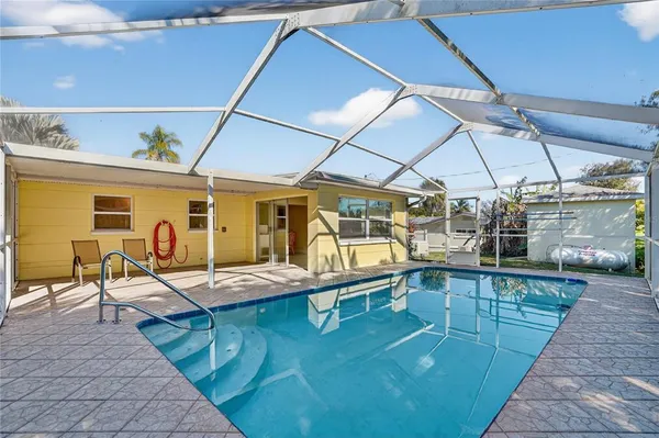 a view of a swimming pool with a patio