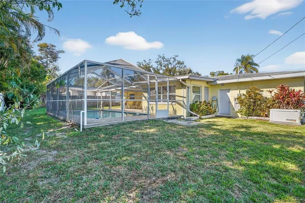 a view of a house with a yard