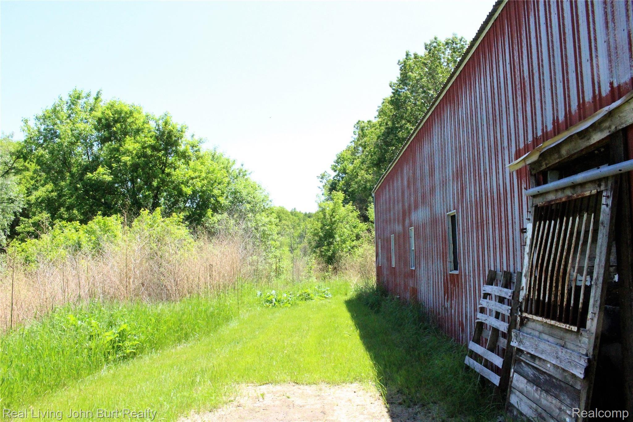 4965 Perryville Road Holly, MI 48442 - Photo 19 of 29 Property line is marked just past the barn