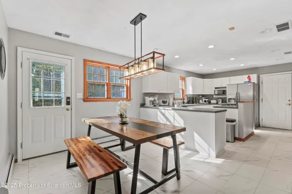 a kitchen that has a sink and a stove in it