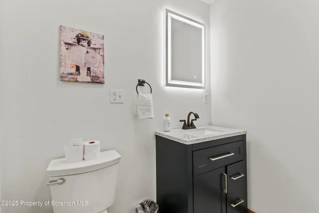 a bedroom with a bed and a table