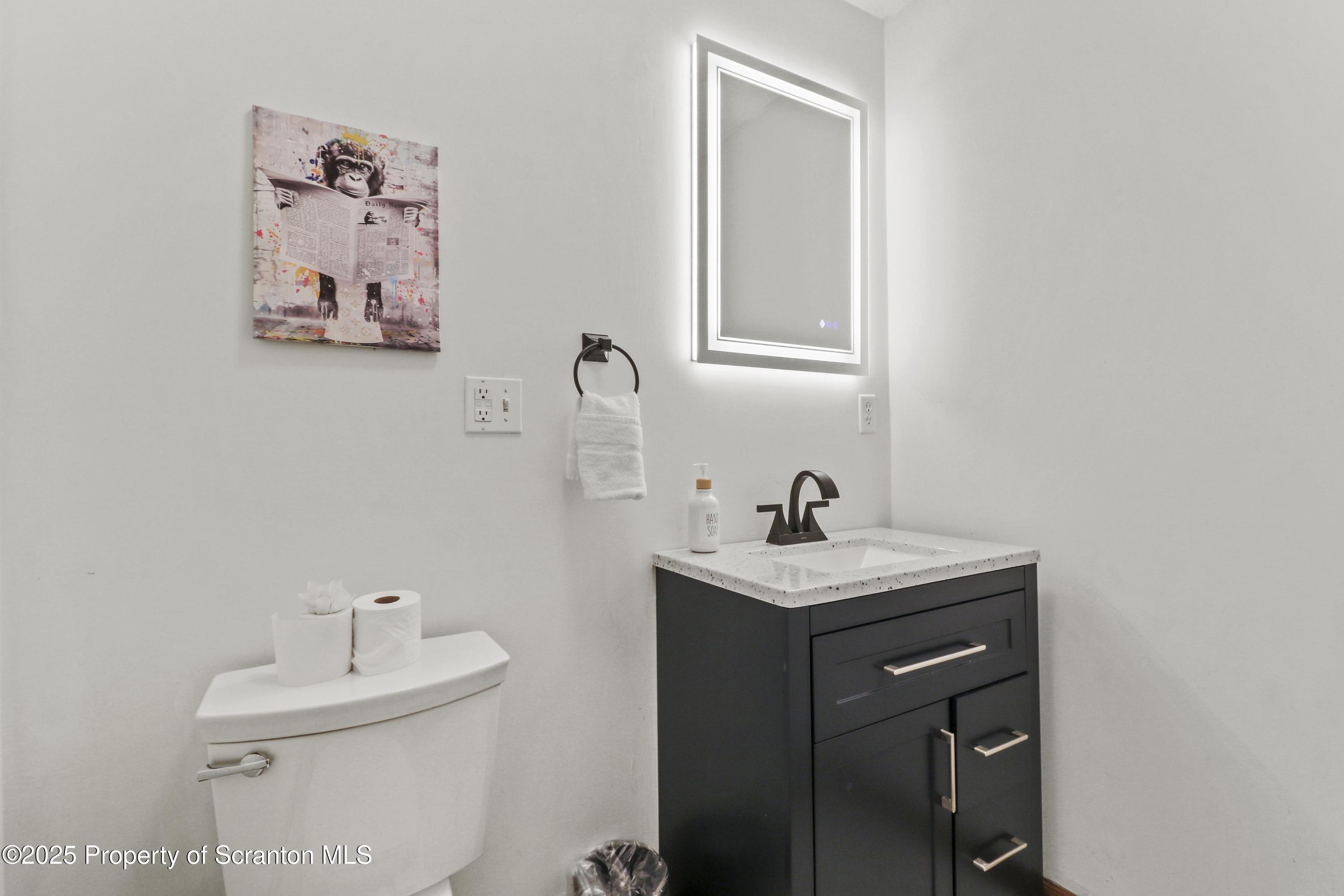 1509 Creek Road New Milford, PA 18834 - Photo 13 of 64 a bathroom with a sink mirror and vanity