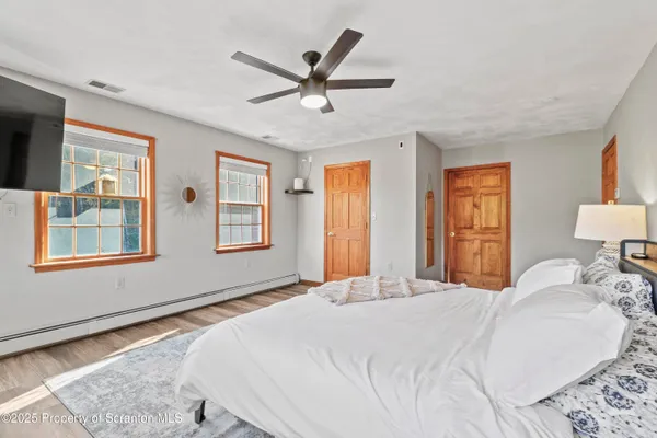 a kitchen with stainless steel appliances granite countertop a stove and a wooden floor