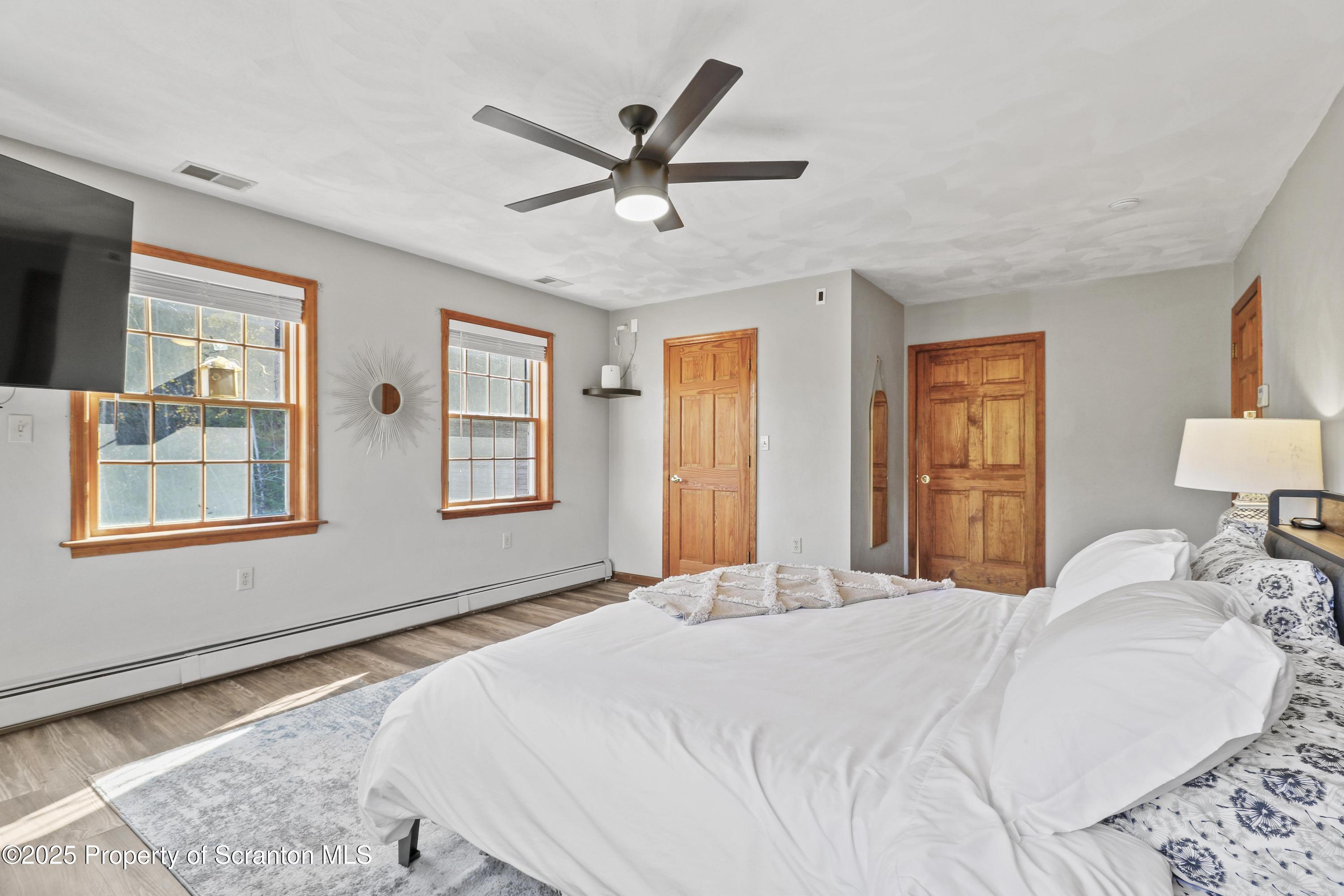 1509 Creek Road New Milford, PA 18834 - Photo 16 of 64 a bedroom with a large bed and a window