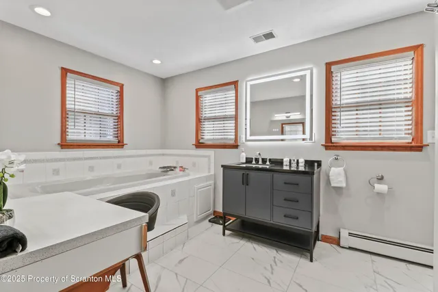 a kitchen with stainless steel appliances granite countertop a stove and a sink