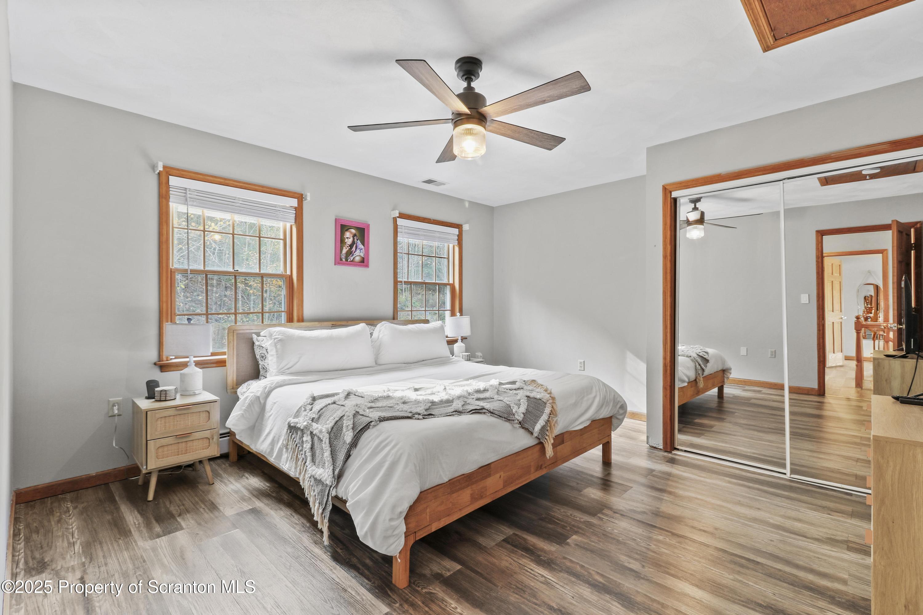 1509 Creek Road New Milford, PA 18834 - Photo 19 of 64 a bedroom with a bed and a table