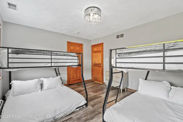 a bathroom with a sink a mirror and a shower